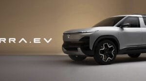 The Legend Returns: Why the 2026 Tata Sierra EV Is the Diesel Killer India Was Waiting For A studio promotional shot of the silver Tata Sierra.EV concept SUV, featuring a futuristic boxy design, black cladding, unique dual-tone alloy wheels, and the text 'SIERRA.EV' displayed prominently on the left.